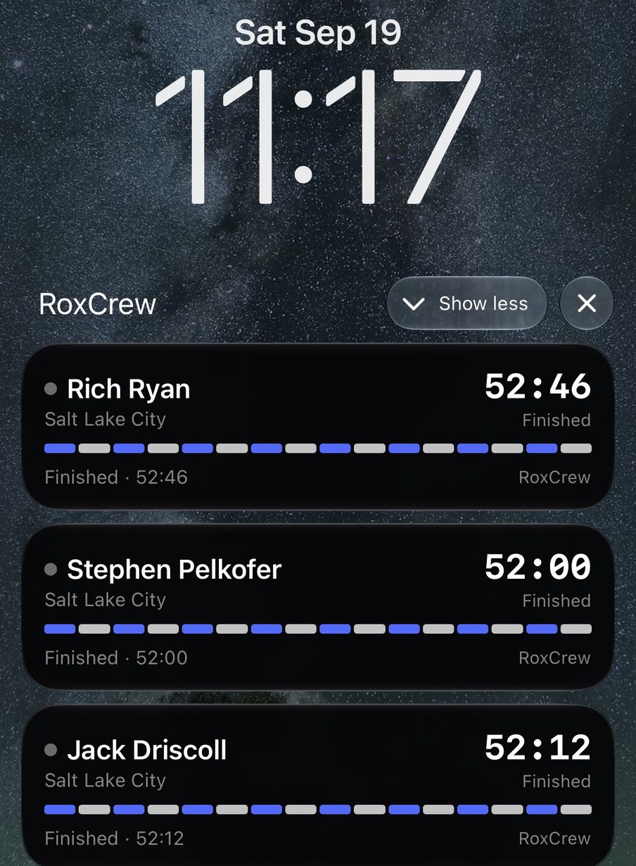 An iPhone lock screen with three RoxCrew cards: Rich Ryan, Stephen Pelkofer and Jack Driscoll at HYROX Salt Lake City, each with a station-by-station progress bar and their finish time